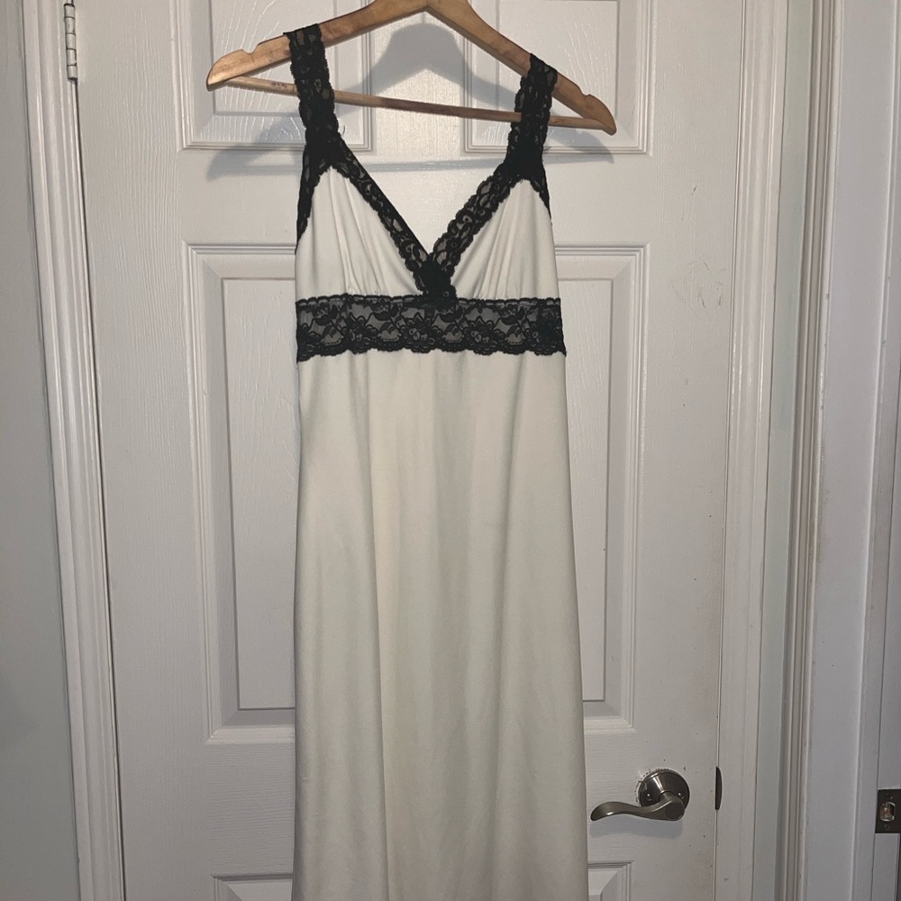 White Betsey Johnson slip dress from mid-2000s w/ black lace detailing. Size M.